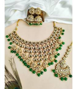 Glamorous Green Kundan Wedding Ensemble: Gold-Plated Lehenga Necklace Set